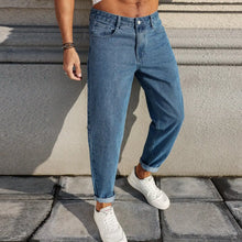 Load image into Gallery viewer, Men's Jeans Are Made of Classic Blue Denim Fabric with a Loose Fit, Making Them an Indispensable Versatile Item in the Wardrobe.

