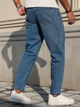 Load image into Gallery viewer, Men's Jeans Are Made of Classic Blue Denim Fabric with a Loose Fit, Making Them an Indispensable Versatile Item in the Wardrobe.
