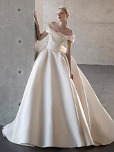 Load image into Gallery viewer, Elegant Satin Off-Shoulder Wedding Dress with Bow Detail
