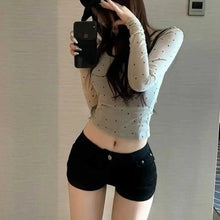 Load image into Gallery viewer, Black shorts for women in summer, with a full crotch and low waist to show off weight and long legs. Wearing them externally, in

