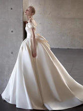 Load image into Gallery viewer, Elegant Satin Off-Shoulder Wedding Dress with Bow Detail
