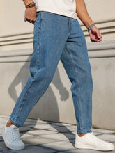 Load image into Gallery viewer, Men's Jeans Are Made of Classic Blue Denim Fabric with a Loose Fit, Making Them an Indispensable Versatile Item in the Wardrobe.
