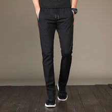 Load image into Gallery viewer, Men&#39;s loose knit Korean version casual sports trousers

